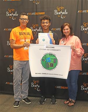 Salyards Middle School eighth grade student Michael Daniels, center, won the 2023 CFISD Student EdTech Expo Logo Contest.